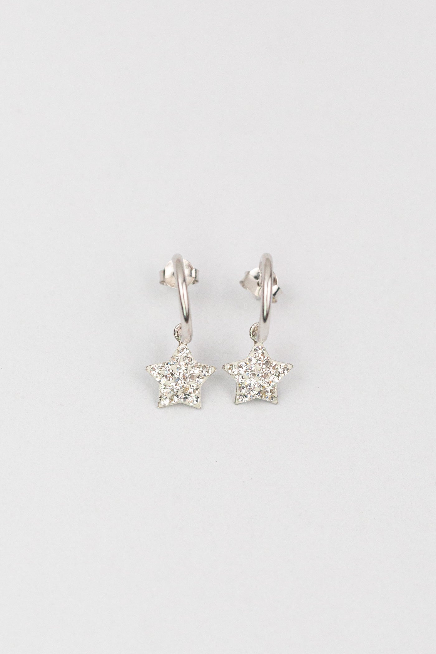 Silver Huggie Earrings with Crystal Star Charm in Clear | Annie and Sisters
